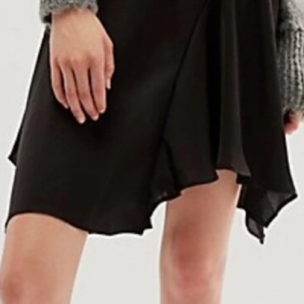Free People size 6 Slim Shine black asymmetrical silky feel mid-rise short skirt